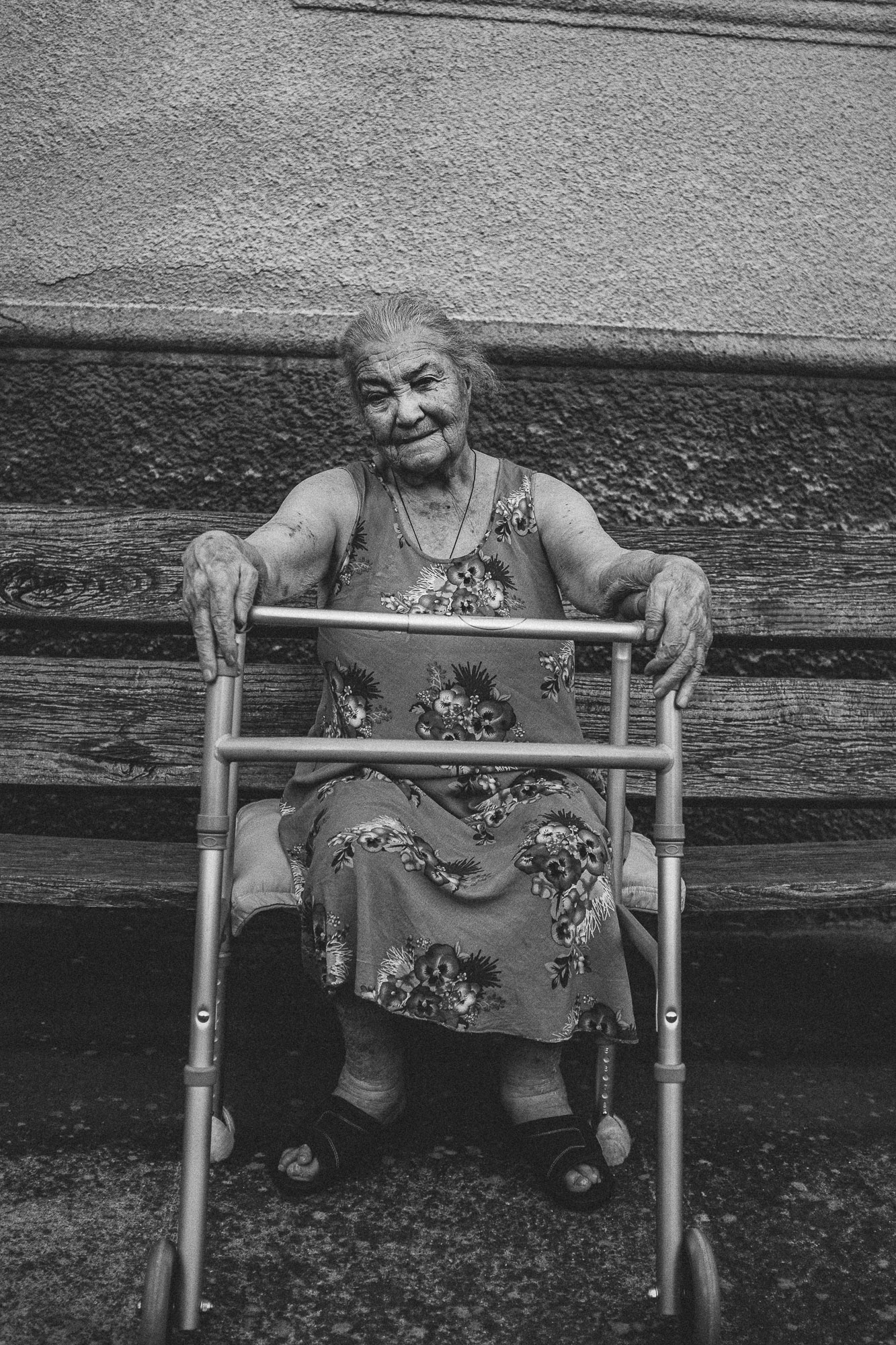 Georgian woman sitting in her yard in former Soviet town
